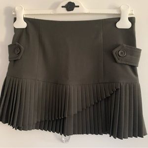 Debbie Shuchat Mini skirt. Dark olive /khaki with pleats. Size 2.